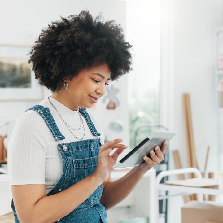 Woman viewing and interacting with tablet screen