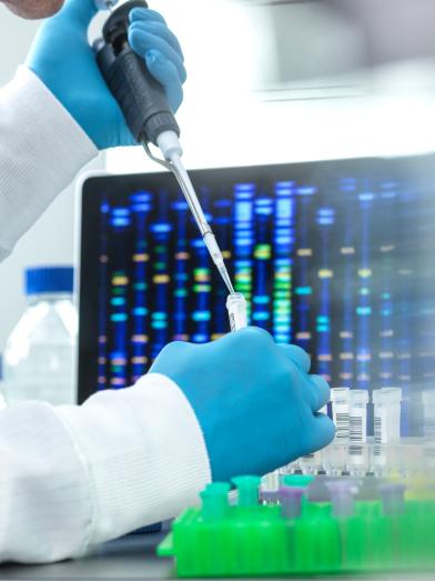 Scientist pipetting sample into a vial for DNA testing