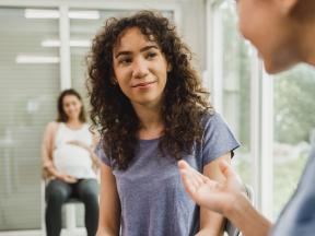 High school girl talking to school nurse