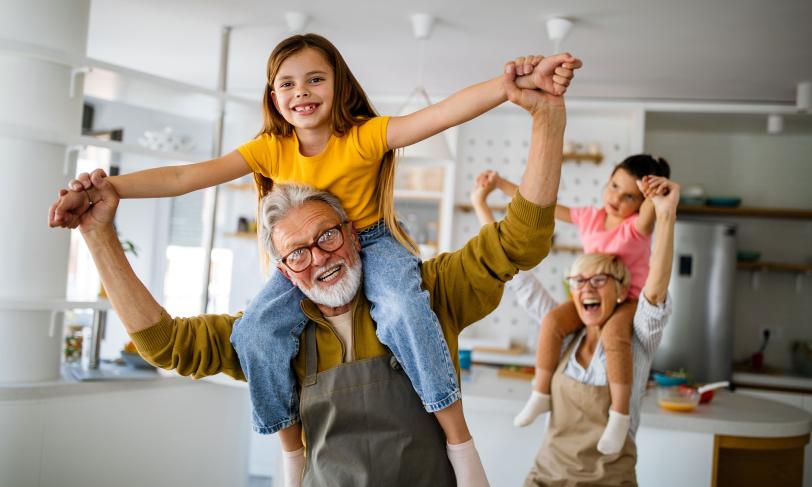 Grandparents playing with grandchildren