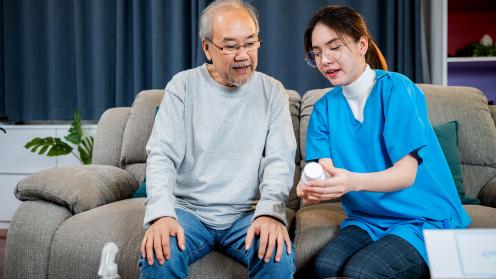 Asian senior man talking to health care provider