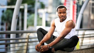 African American man stretching before a run