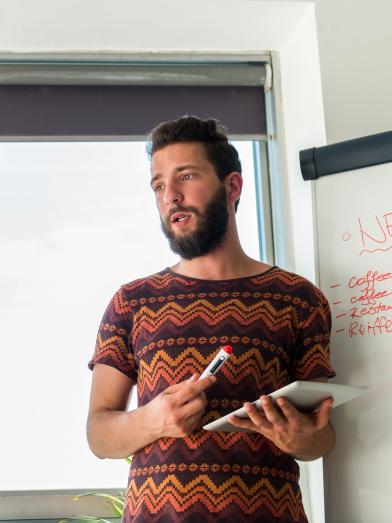 Bearded man giving presentation