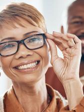 Smiling African American woman with glasses and her husband