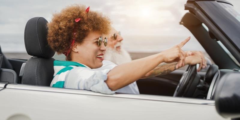 happy-senior-couple-having-fun-in-convertible-car