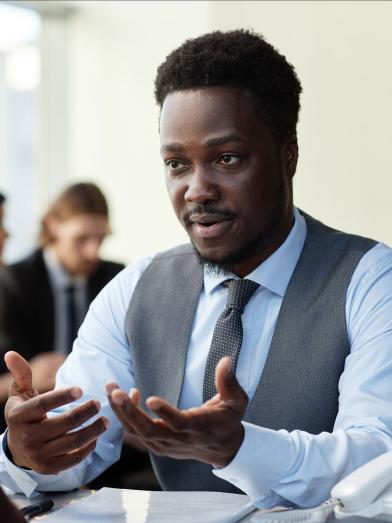 African American business man talking to client