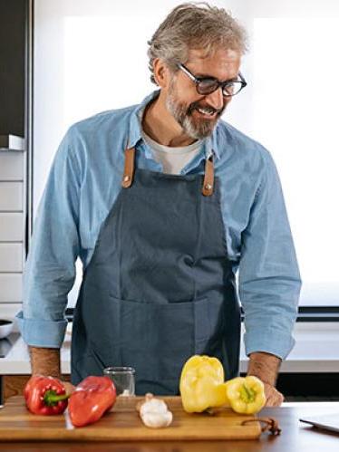 Man in kitchen looking