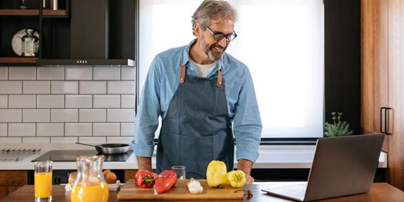 Man in kitchen looking