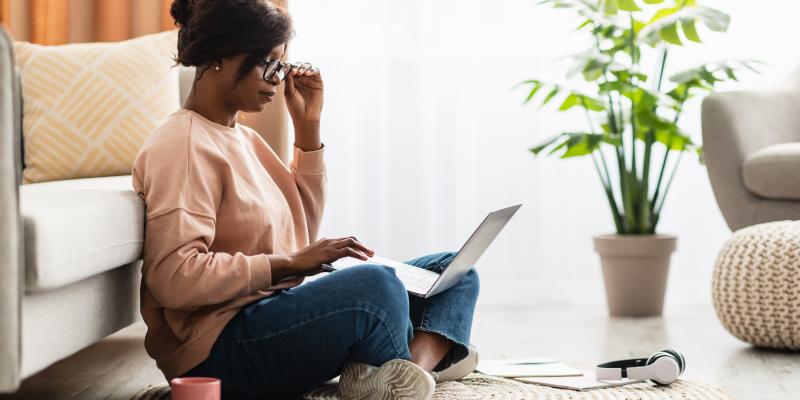 Lady using Laptop Wearing Glasses