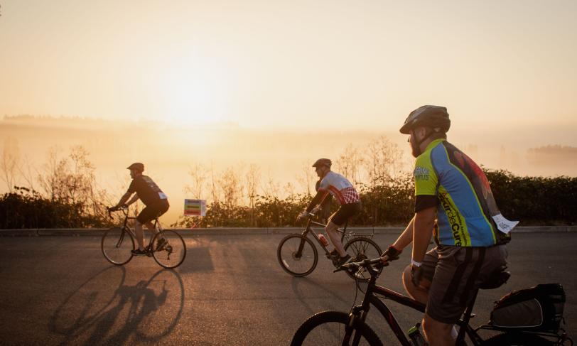 Bikers in the Pacific Northwest riding along the coast in the evening