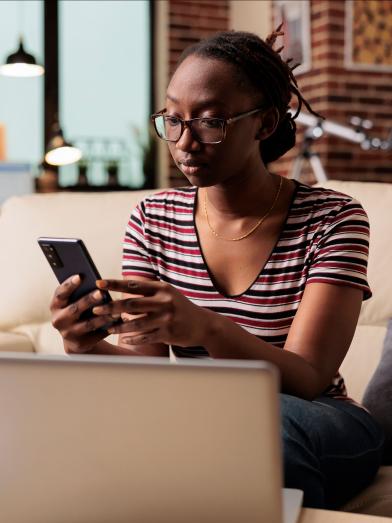 African American woman looking at her phone