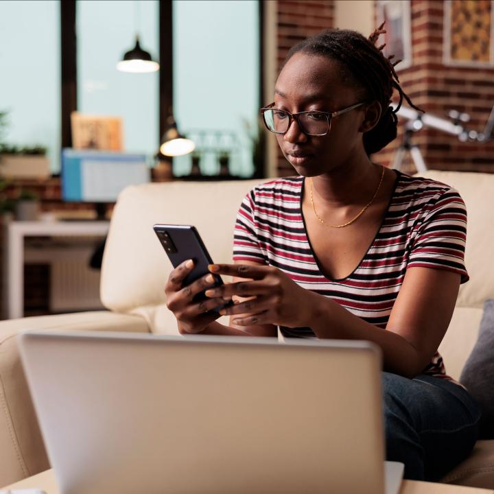 African American woman looking at her phone