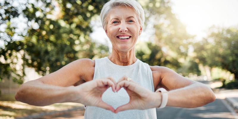 Woman making heart sign