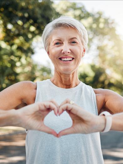 Woman making heart sign