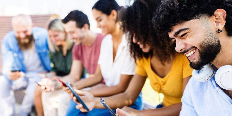 Group of people donating using their phone