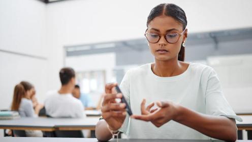 woman using blood glucose meter