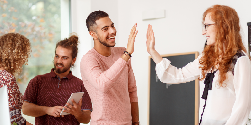 coworker giving high five