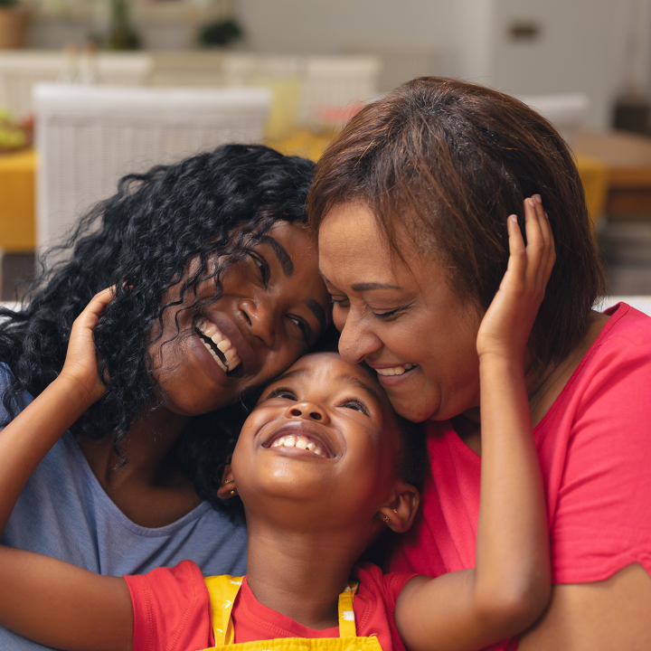 Happy family of a girl, mother, and grandmother