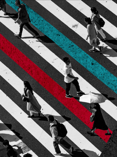 Overhead picture of people walking across a road