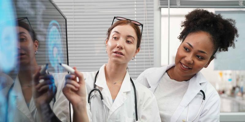 group of doctors looking at xray medical practioner hero