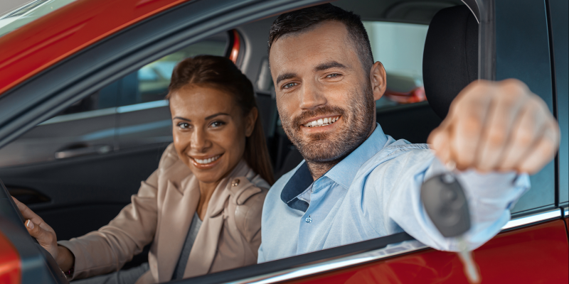 A couple giving away the car keys